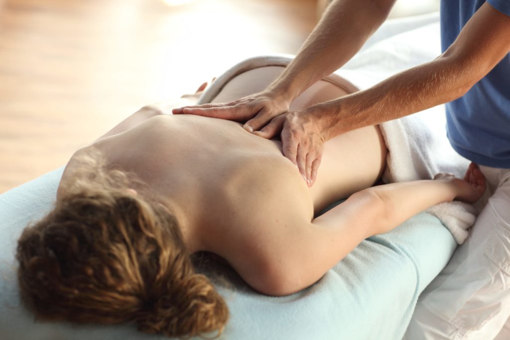 lady enjoy massage from a male therapist